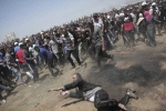 Palestinians fired down in gaza, Palestinians fired down in gaza, palestinians shot dead after bloodiest gaza day on relocating us embassy, Gaza border